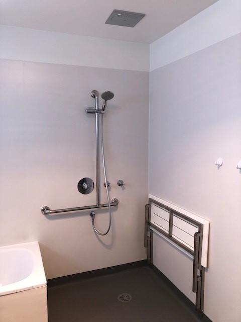 Accessible shower featuring a spacious layout to support mobility and ease of use.