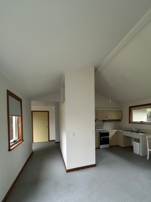 Level flooring, and wide hallways and doorways improve accessibility through the unit. The high ceiling in the open plan area takes full advantage of the natural light. 