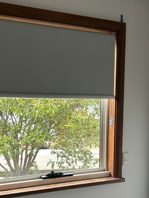 In the bedroom, there's a leafy outlook. 
